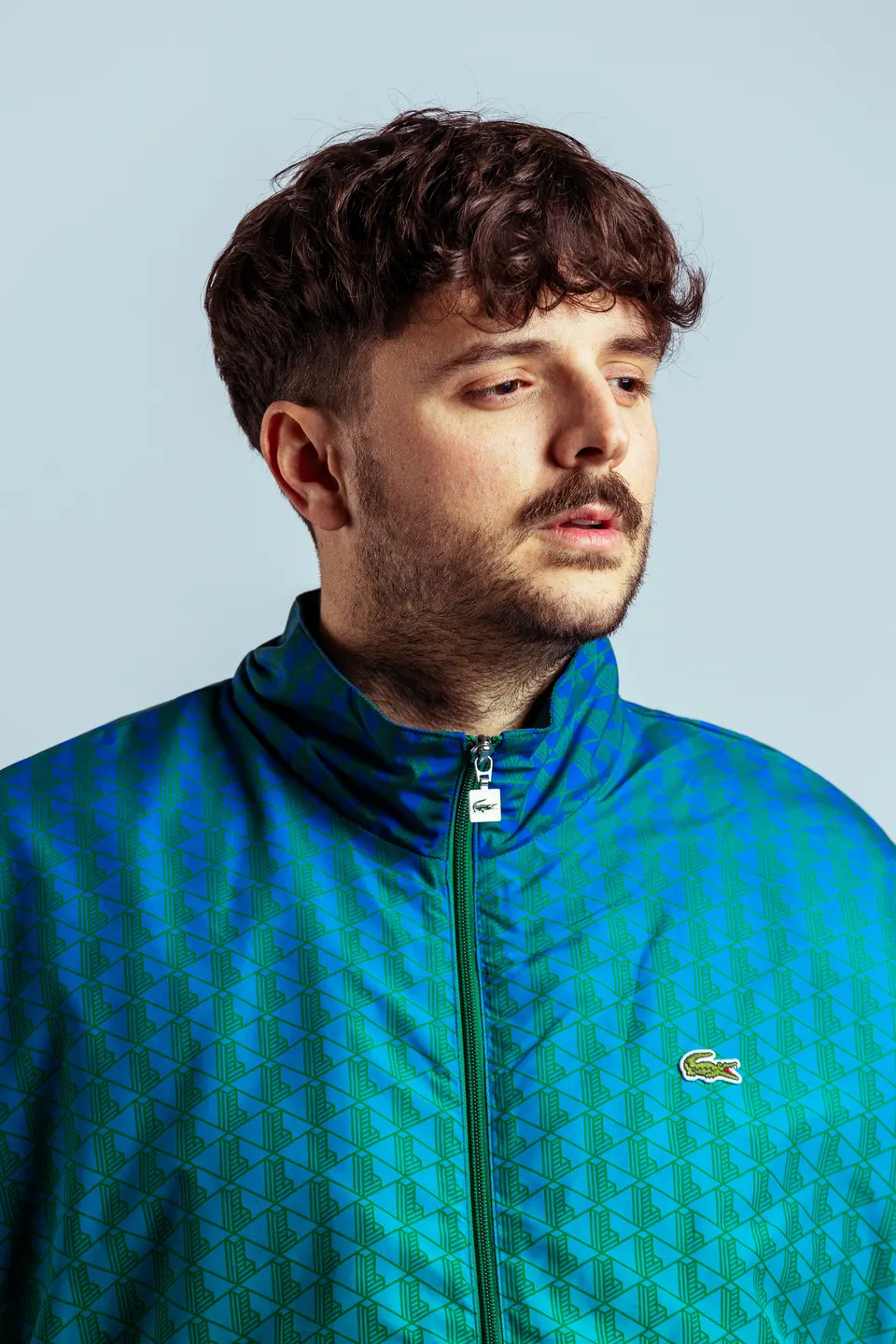 Portrait of Meloko in a blue and green jacket