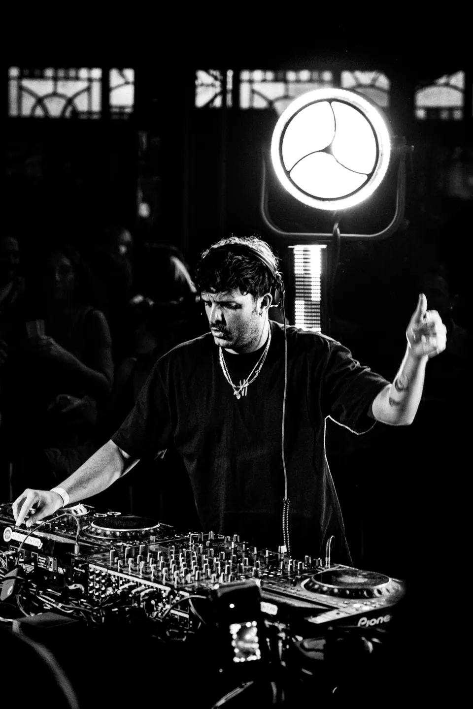 Meloko behind the decks, black and white